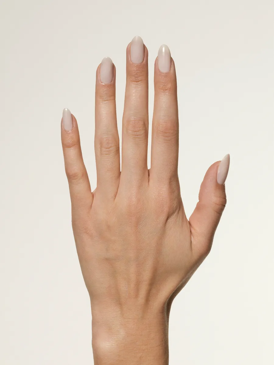 A hand shown with the selected lacquer applied to the nails